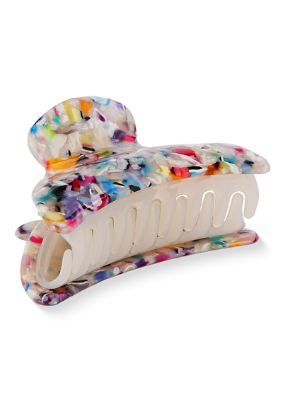 Tortoiseshell claw clip with multicolored confetti pattern and cream-colored grip section.