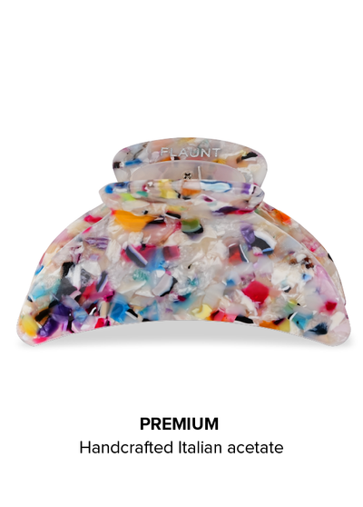 Tortoise shell claw clip with multicolored confetti pattern throughout, branded "FLAUNT" on clasp.
