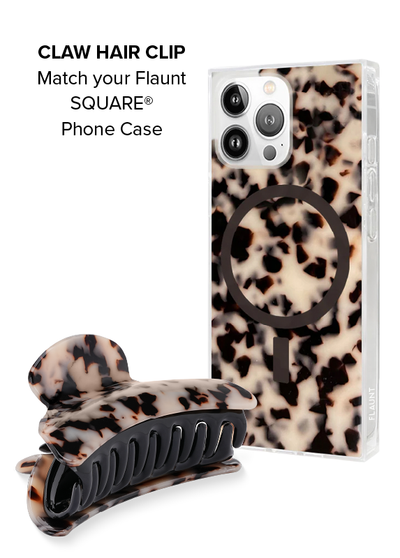 Blonde tortoise shell claw clip with black ribbed grip and matching phone case with black ring mount.