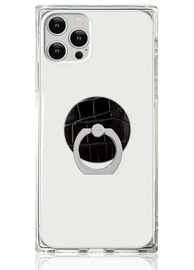 Clear phone case with black crocodile textured circular ring stand attached to back.