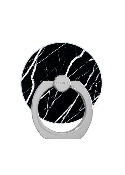 Black marble patterned circular phone ring stand with white veining and silver metal grip band.