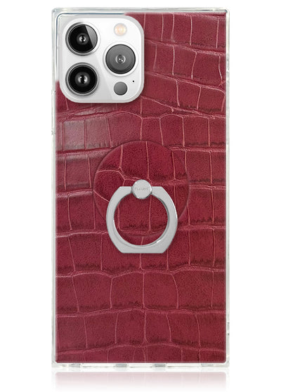 Burgundy crocodile-textured phone case with white circular ring stand attached to back.