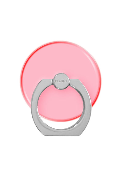 Neon pink circular phone ring stand with gray metal grip and rotating ball joint labeled "FLAUNT".