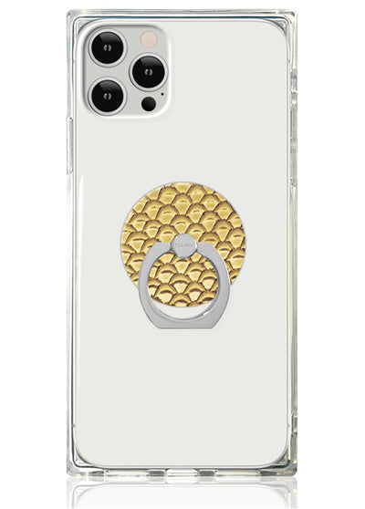 Clear phone case with gold snakeskin-textured circular ring stand and silver metal loop on white background.