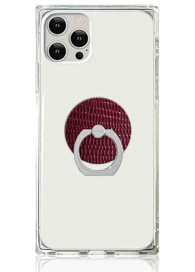 Burgundy lizard textured faux leather phone ring stand with silver metal loop attached to clear protective phone case.