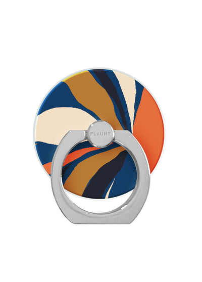 Navy, gold, and coral abstract patterned circular phone ring stand with gray metal base and rotating grip.