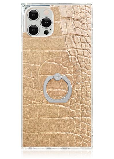 Tan crocodile textured phone case with silver ring stand attached to back, fits iPhone Pro model.