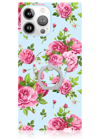 Phone case with pink rose and green leaf pattern on light blue background, featuring gray circular ring stand.