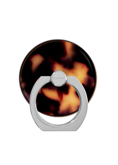 Circular tortoise shell patterned phone ring stand with silver metal base and rotating grip mechanism.
