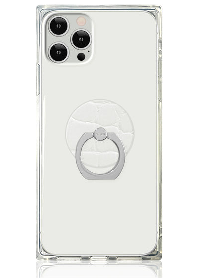 Clear phone case with white crocodile textured circular ring stand mounted on back.