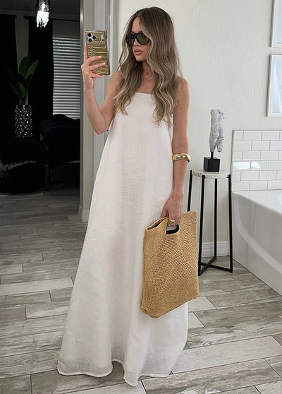 Gold crocodile-textured iPhone case with square shape and gilded finish held in hand.
