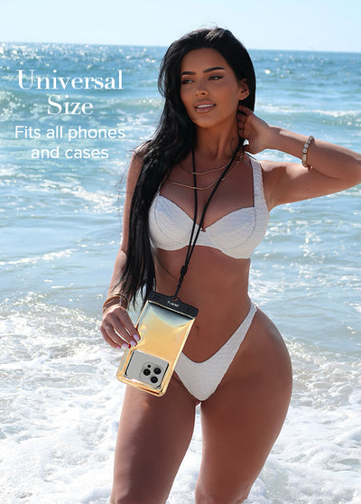 Gold metallic waterproof phone pouch with black lanyard worn around neck at beach.