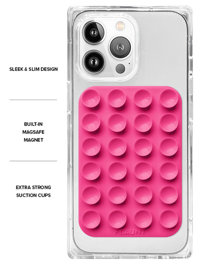 Neon pink suction mount with grid of circular cups attached to clear phone case with triple camera setup.