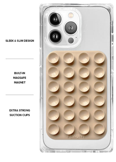 Nude MagSafe suction mount with grid of circular cups attached to clear phone case with camera cutout.