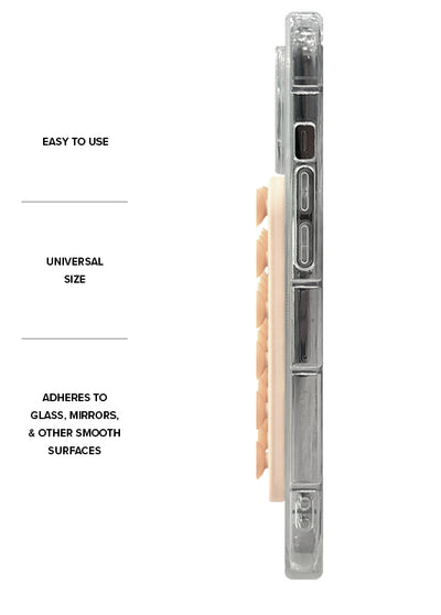 Nude-colored MagSafe suction mount with clear mounting arm and adhesive backing, shown in side view.