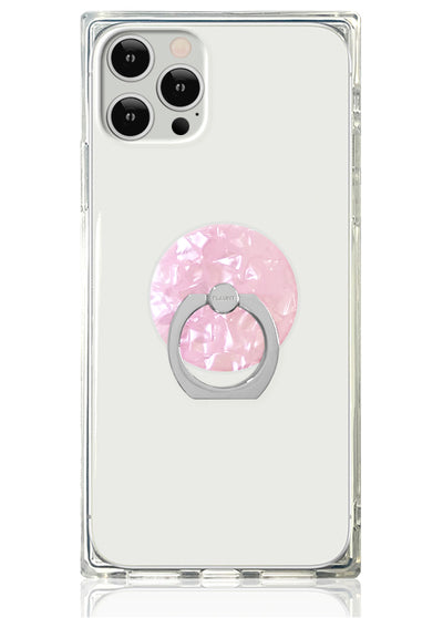 Clear phone case with blush pink pearl-textured circular ring stand attached to back.