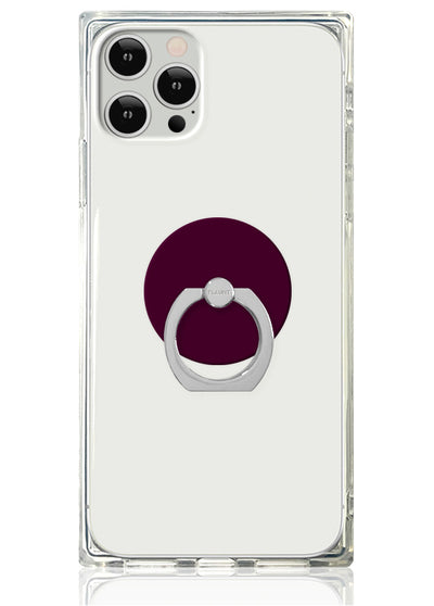 Clear phone case with burgundy circular backing and silver metal ring stand attached to center.