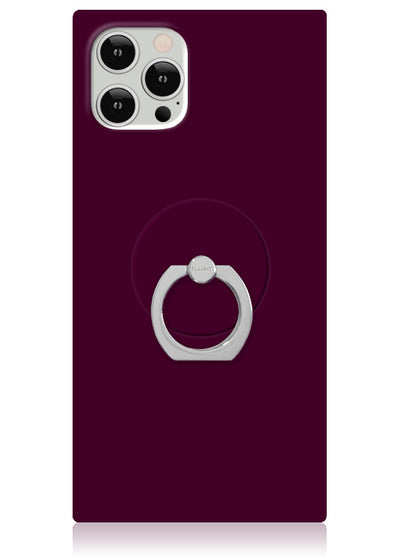 Burgundy phone case with silver metal ring stand attached to back, shown with smartphone camera detail at top.