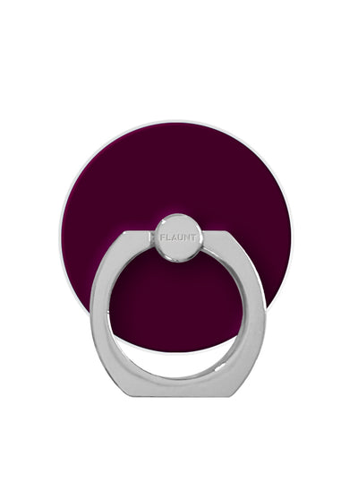 Burgundy circular phone ring stand with silver metal loop and central grip ball marked "FLAUNT."