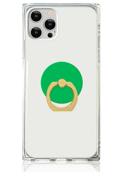 Clear phone case with gold ring stand attached to emerald green circular backing on white background.