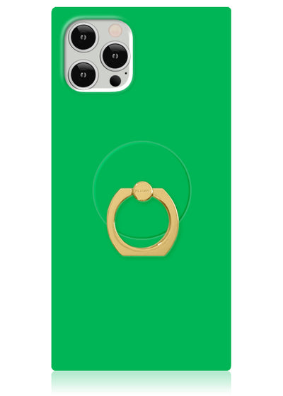 Gold ring stand with circular grip attached to emerald green phone case, shown on smartphone.