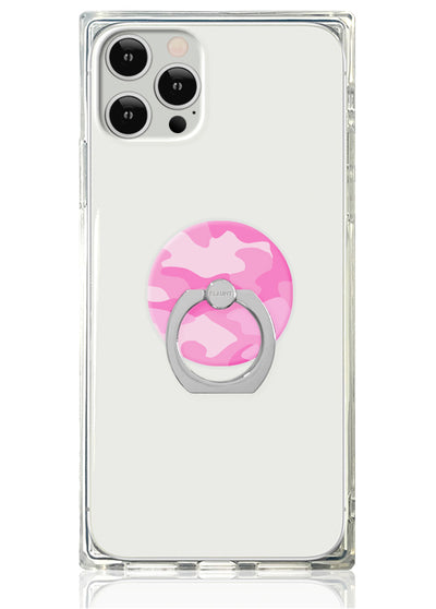 Clear phone case with pink camouflage circular ring stand and silver metal attachment on smartphone.