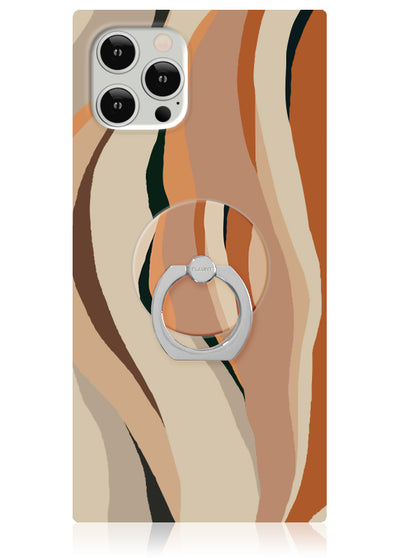 White iPhone case with geometric stripe pattern in tan, orange, and black tones, featuring a silver ring stand.
