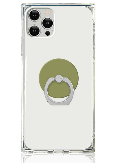 Olive green adhesive ring stand with silver metal grip attached to clear phone case on white smartphone.