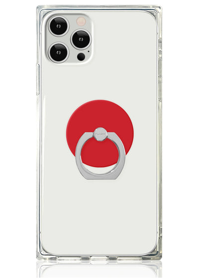 Clear phone case with red circular adhesive base and silver metal ring stand attached to back.