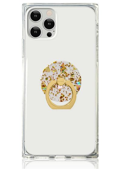 Clear phone case with gold ring stand featuring white and gold flake circular design in center.