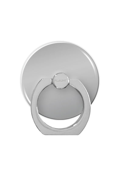 Silver metal phone ring stand with circular adhesive base and rotating band grip marked "FLAUNT."