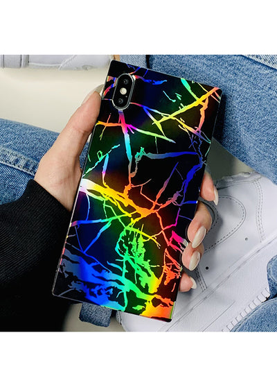 Black iPhone case with holographic rainbow lightning bolt pattern held in hand.