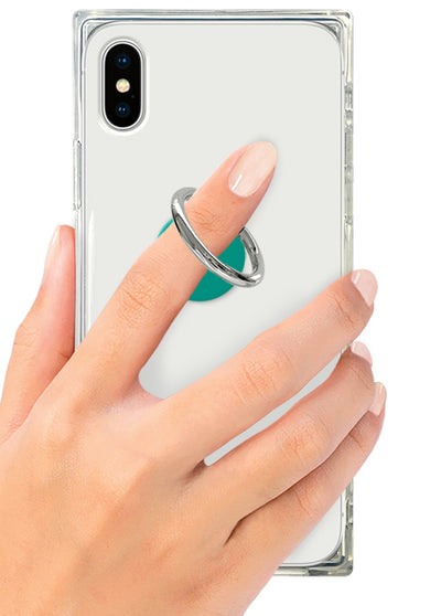 Teal and silver phone ring stand attached to clear phone case, held in hand.