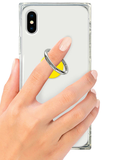 Yellow and gray metal ring stand attached to clear phone case on smartphone held in hand.