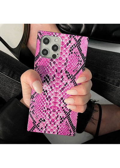 Pink and black python-textured square iPhone case with camera cutout, held in hand.