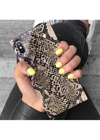Python-textured iPhone case in beige and black with dual camera cutout, held in hand.