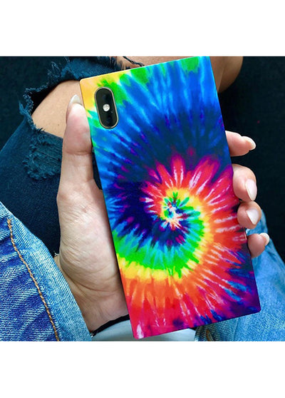 Square tie dye iPhone case with multicolored spiral pattern in blue, green, yellow, orange, red, and pink held in hand.