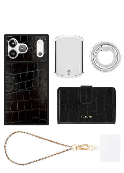Black crocodile-textured phone case, white compact mirror, clear ring holder, black wallet, and gold chain wristlet.