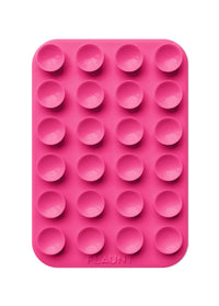 ["Pink", "silicone", "mold", "with", "24", "round", "hemisphere", "cavities", "and", ""Flaunt"", "text", "at", "bottom."]